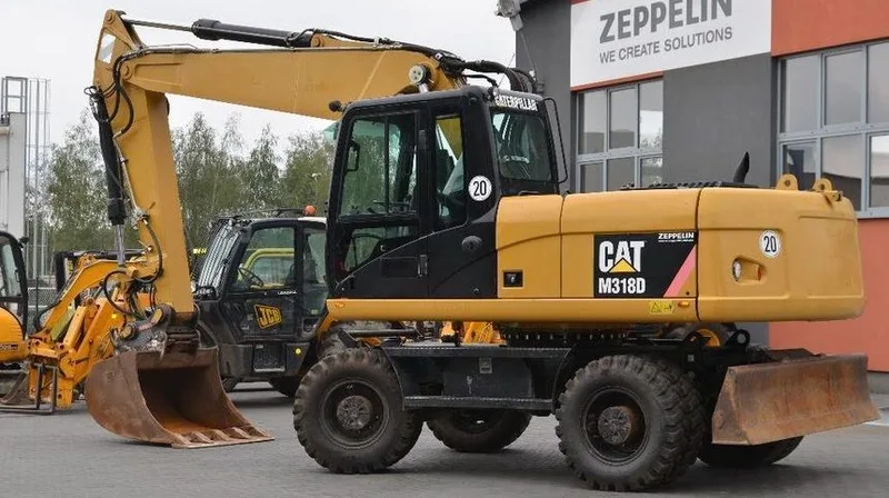 Колесный экскаватор Caterpillar 18M3